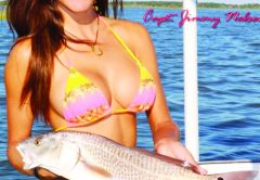 Luiza shows off a nice Redfish. For more information on this amazing lady angler, go to: www.fishingwithluiza.com