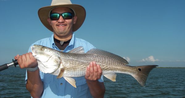Jacob gets a top-slot redfish using chunk mullet strategically placed on the end of a sandbar which was covered up in live mullet!