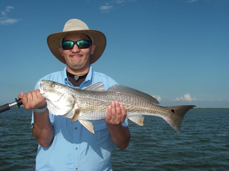 Jacob gets a top-slot redfish using chunk mullet strategically placed on the end of a sandbar which was covered up in live mullet!