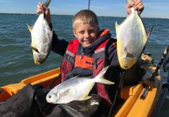Braden Nelli with his first couple of pompano.