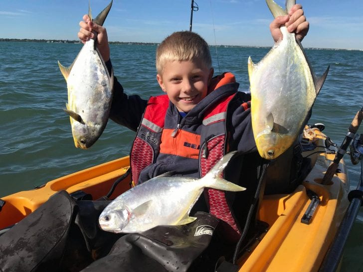 Braden Nelli with his first couple of pompano.