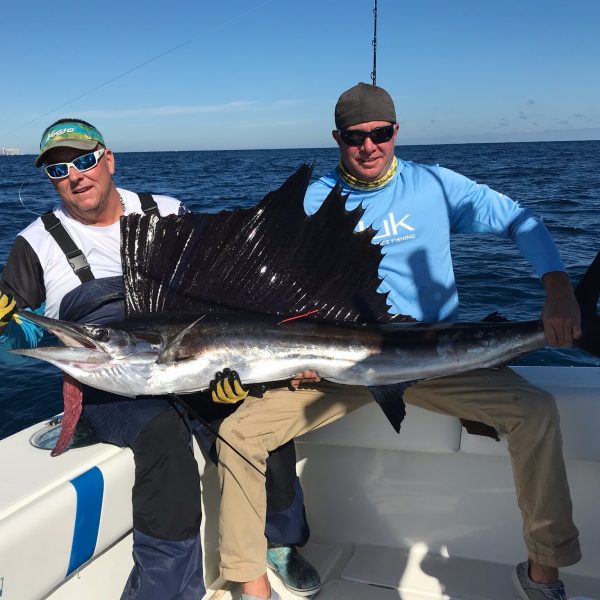 John McClellan with a tagged sailfish out of palm beach kite fishing