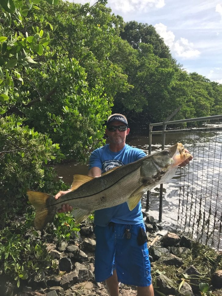 Neil McConnell at Lake Worth Spillway with 46 inch 32 lbs snook