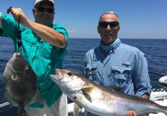Paul Caruso and Chappy show off their catch this past season while fishing with Underdog Charters.
