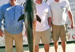 Shane Lundien with a massive cobia caught off Destin.