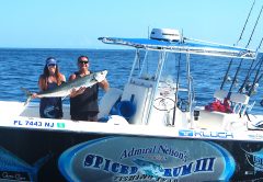 Billy and Sheri with her kingfish landed late on a Sunday afternoon