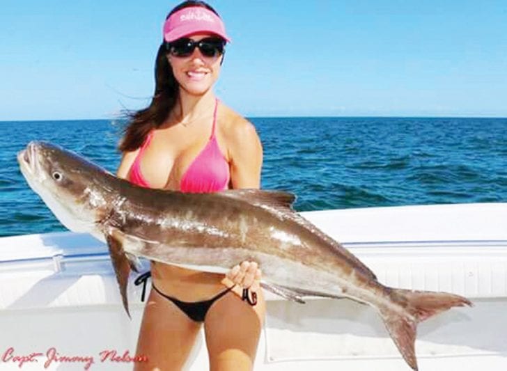 Luiza shows off a beautiful cobia. Catch more about this amazing lady angler at:  www.fishingwithluiza.com