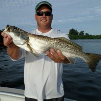 Mike Barker, inventor of The Chum Buddy, shows off a speckled trout caught while getting his first inshore slam!