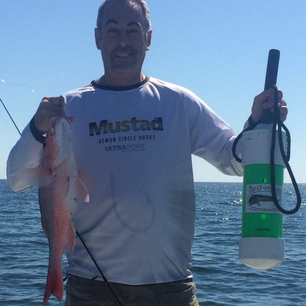 Paul Caruso shows off the benefits of using his Chum Buddy to bring up the red snapper.