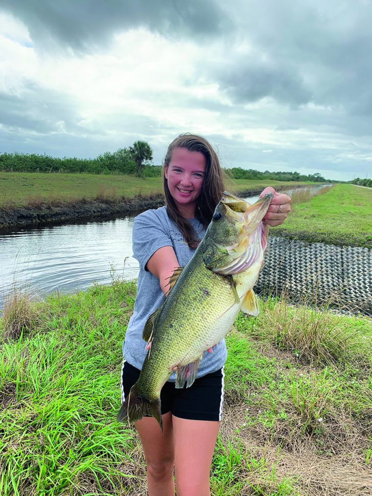 Emily Hanzlik with a 7.4lb largemouth bass caught using a Senko on 8 lb test.  | Coastal Angler & The Angler Magazine