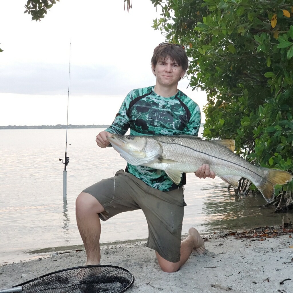 Fishing captain lands first 40-inch redfish; client snags 40-inch snook