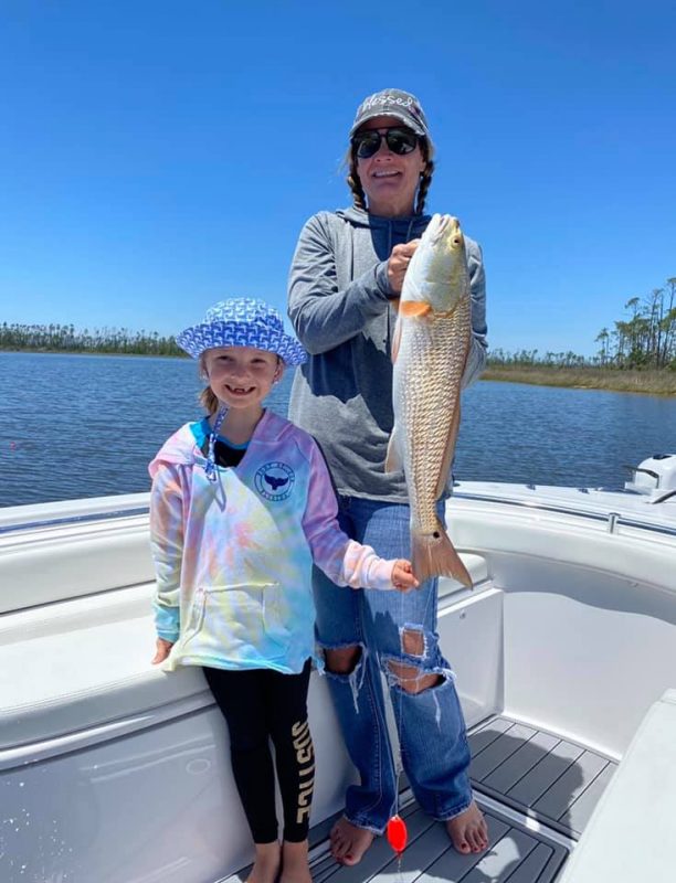 Vicky and Bella One Of Many Red Fish - Coastal Angler & The Angler