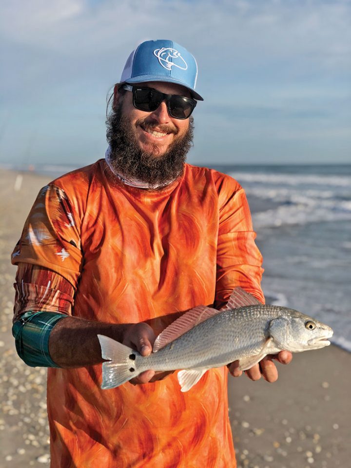 Surf fishing guide Eric Newton with an ocean roaming redfish.