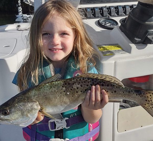 Little 3-year-old Gracie caught a nice 18" spotted seatrout in chilly water using a Slayer Inc. paddle tail fishing with her dad, Captain Shane Trottier of Whatever Turns U On Fishing Charters.