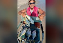 Marco Pompano on the beach with a cart full of pompano