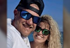 Chris Mansfield of Reel Healin Outdoors smiling in a selfie with a woman by the water