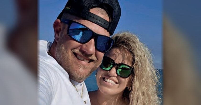 Chris Mansfield of Reel Healin Outdoors smiling in a selfie with a woman by the water
