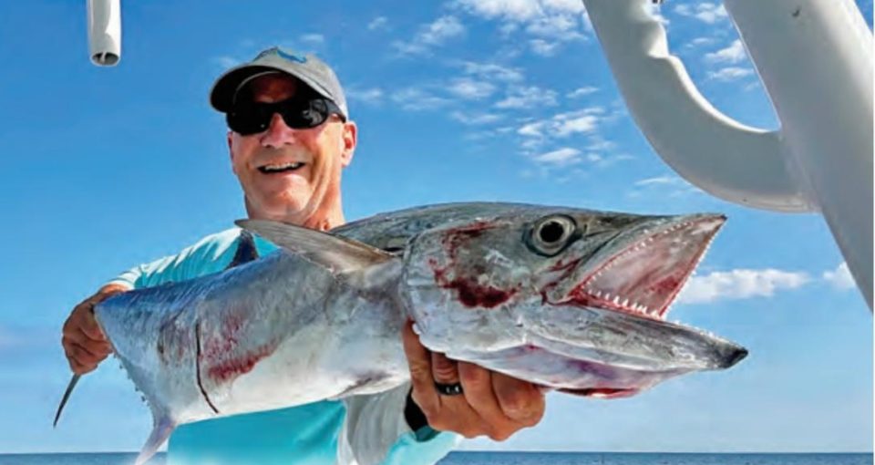 Will Schmidt holding a big kingfish