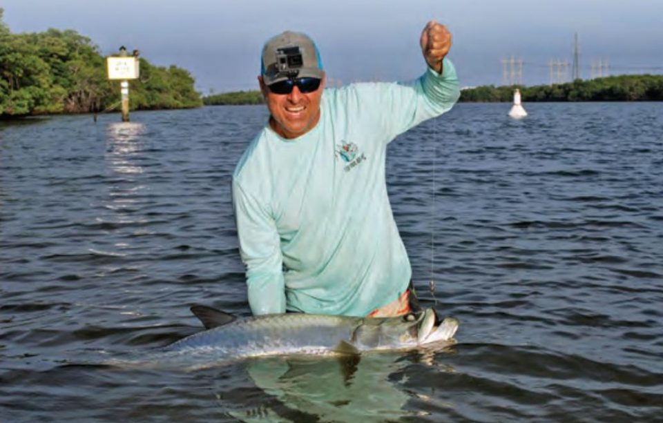 Capt. Mike Smith wading with a tarpon