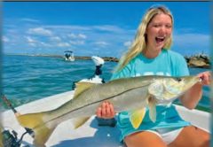 Young angler holding a big snook