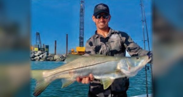 Captain Marty Goldys of Reel Harmony Fishing Charters holding a snook