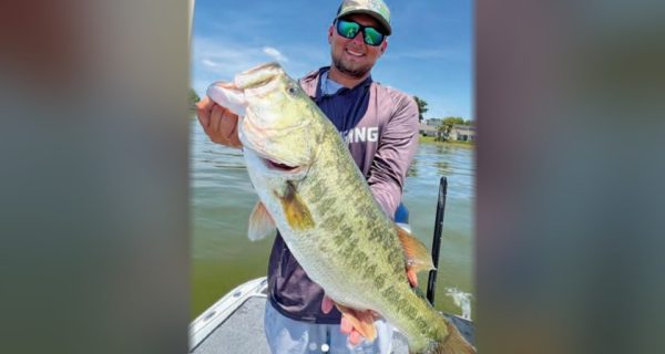 Angler holding a big largemouth bass