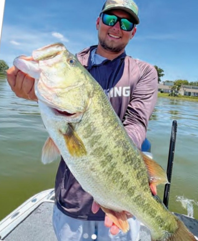 Angler holding a big largemouth bass