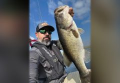 Jessie Diaz holding a big largemouth bass