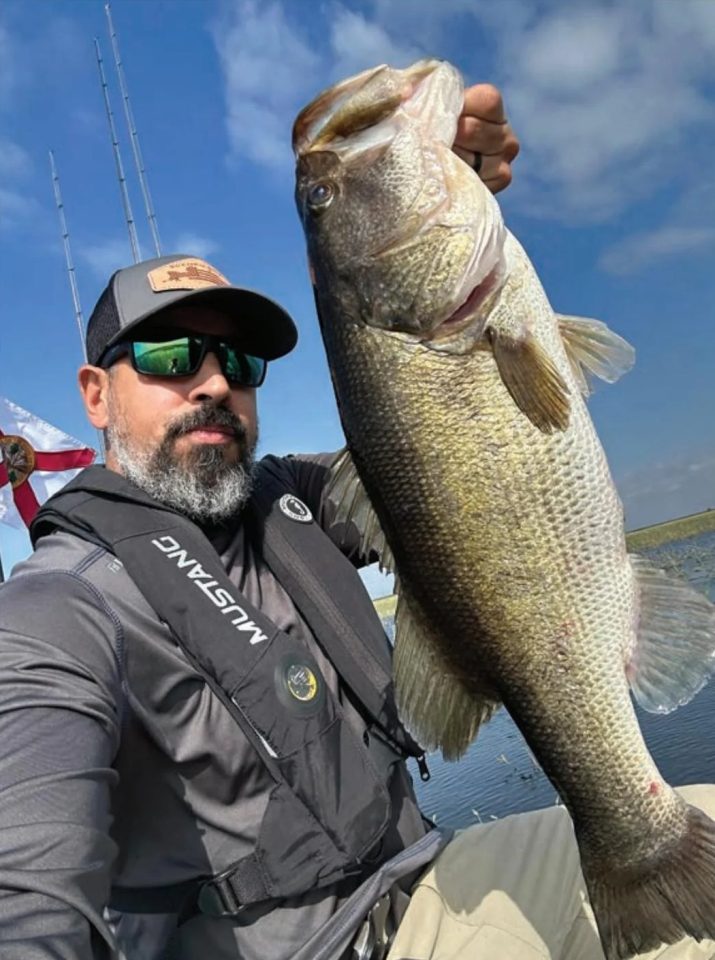 Jessie Diaz holding a big largemouth bass
