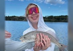 Youth angler of the month Mya LeMand holding a redfish