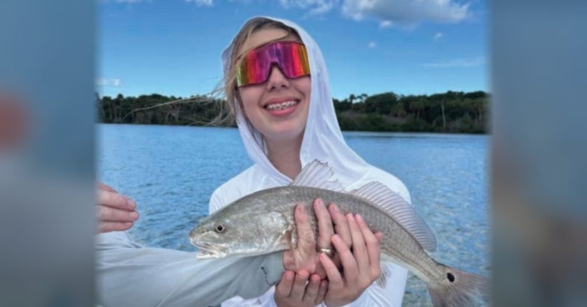 Youth angler of the month Mya LeMand holding a redfish