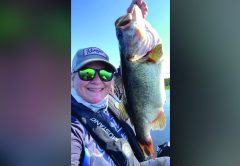 Angler holding a largemouth bass