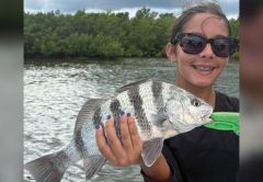 Young angler holding a sheepshead in the Edgewater backcountry